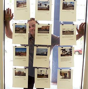 MASTERMIND: Xavier Cortada in his studio, 104 SW Ninth St. in Miami, used readers' photos and memories to create part of the expansive multimedia installation that will be in The Miami Herald's lobby this month.